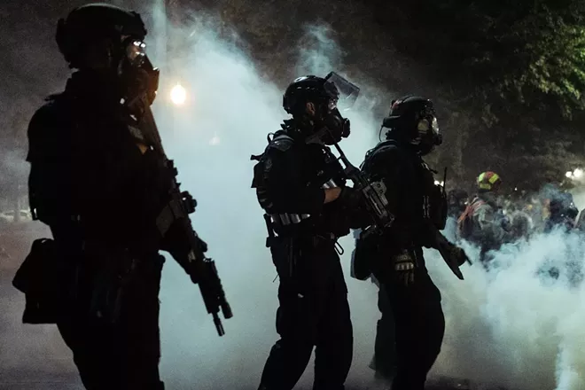 Federal agents during a protest in Portland, Ore., early Tuesday morning, July 28, 2020. After weeks of clashing with protesters, federal forces will soon begin withdrawing from Portland, Gov. Kate Brown of Oregon said Wednesday, July 29, 2020. - MASON TRINCA/THE NEW YORK TIMES