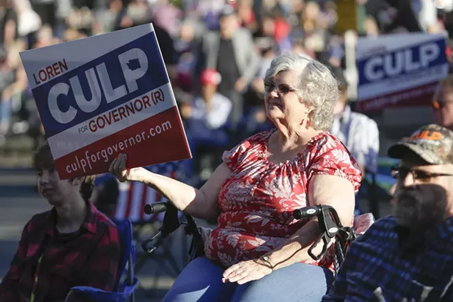 A supporter of Republican gubernatorial candidate Loren Culp attends a free rally and concert in in Arlington, Washington, on Aug. 22, 2020. - JASON REDMOND FOR CROSSCUT