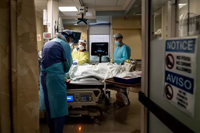 A medical team tends to a COVID-19 patient at Houston Methodist Hospital in Houston, July 5, 2020. Nearly a third of hospitalized COVID-19 patients experienced some type of altered mental function, ranging from confusion to delirium to unresponsiveness, in the largest study to date of neurological symptoms among coronavirus patients in an American hospital system. - ERIN SCHAFF/THE NEW YORK TIMES