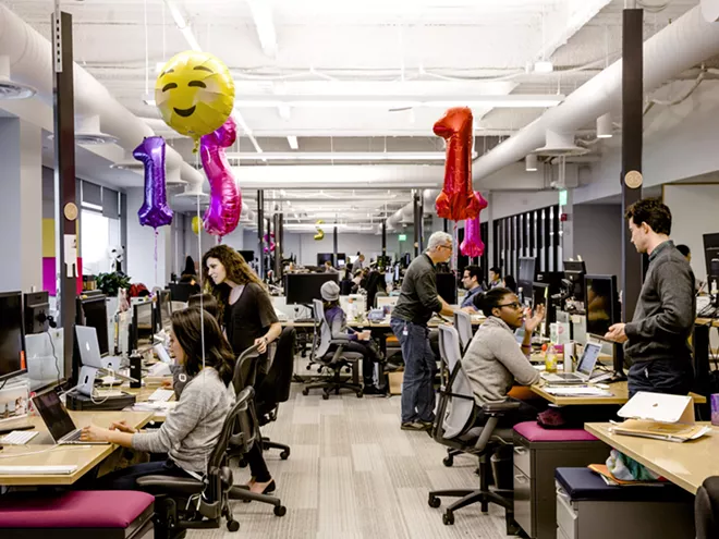 Employees in pre-pandemic times at the headquarters of Slack in San Francisco, Feb. 7, 2017. Most Slack employees have said they would like to have a mix of at-home and office work even after the pandemic subsides. - CARLOS CHAVARRÍA/THE NEW YORK TIMES