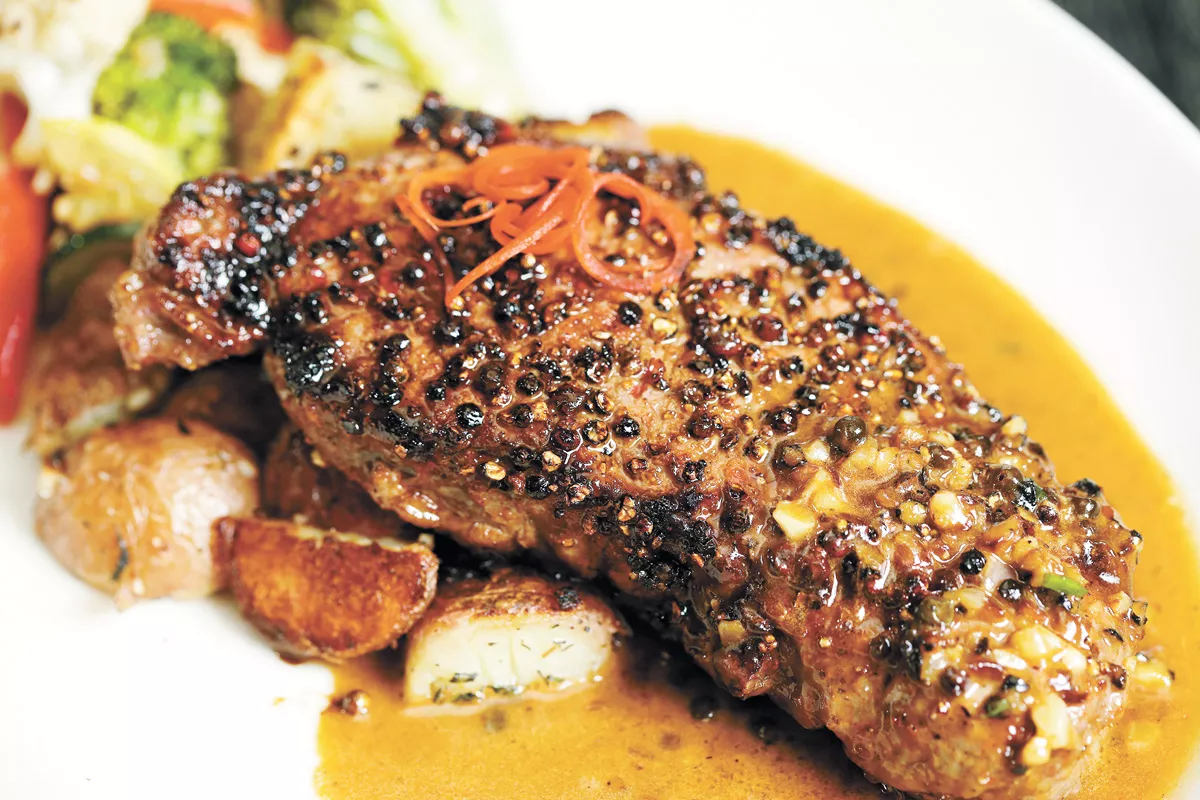 Peppercorn steak is one of six entree options for Max at Mirabeau's Thanksgiving dinner. - YOUNG KWAK PHOTO
