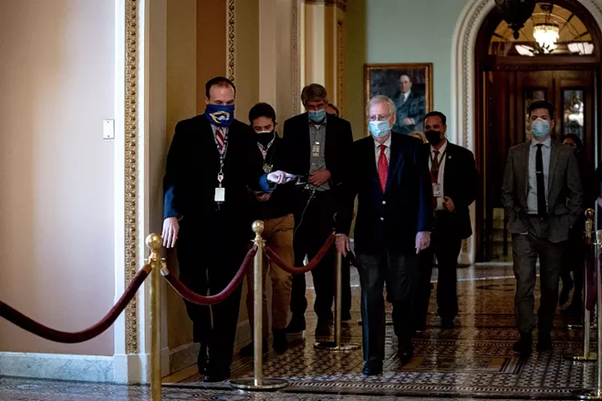 Senate Majority Leader Mitch McConnell (R-Ky.) walks to his office at the Capitol in Washington on Monday, Dec. 14, 2020. - ANNA MONEYMAKER/THE NEW YORK TIMES