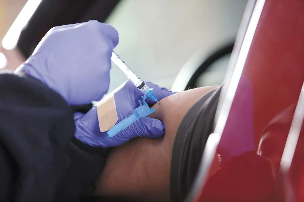 A dose of the Moderna COVID-19 vaccine is administered at the Spokane Fire Department Training Center. - YOUNG KWAK PHOTO