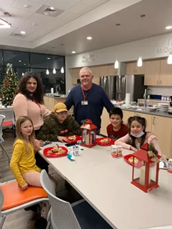 Kids enjoy a meal provided through Care to Nourish on Christmas Day at the Ronald McDonald House of the Inland Northwest. - COURTESY RMHC OF THE INLAND NORTHWEST