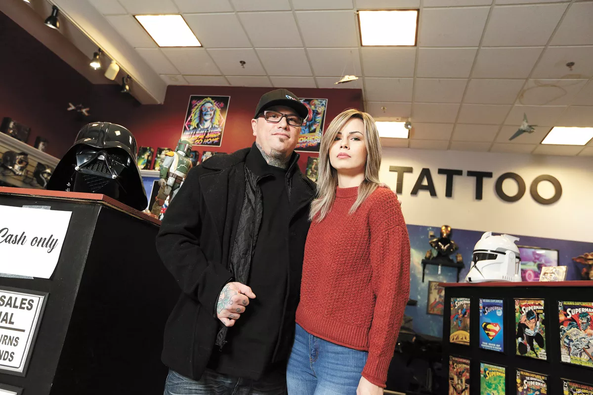 Joe Riley and his wife Shalee in the tattoo shop that he owns. - YOUNG KWAK PHOTO