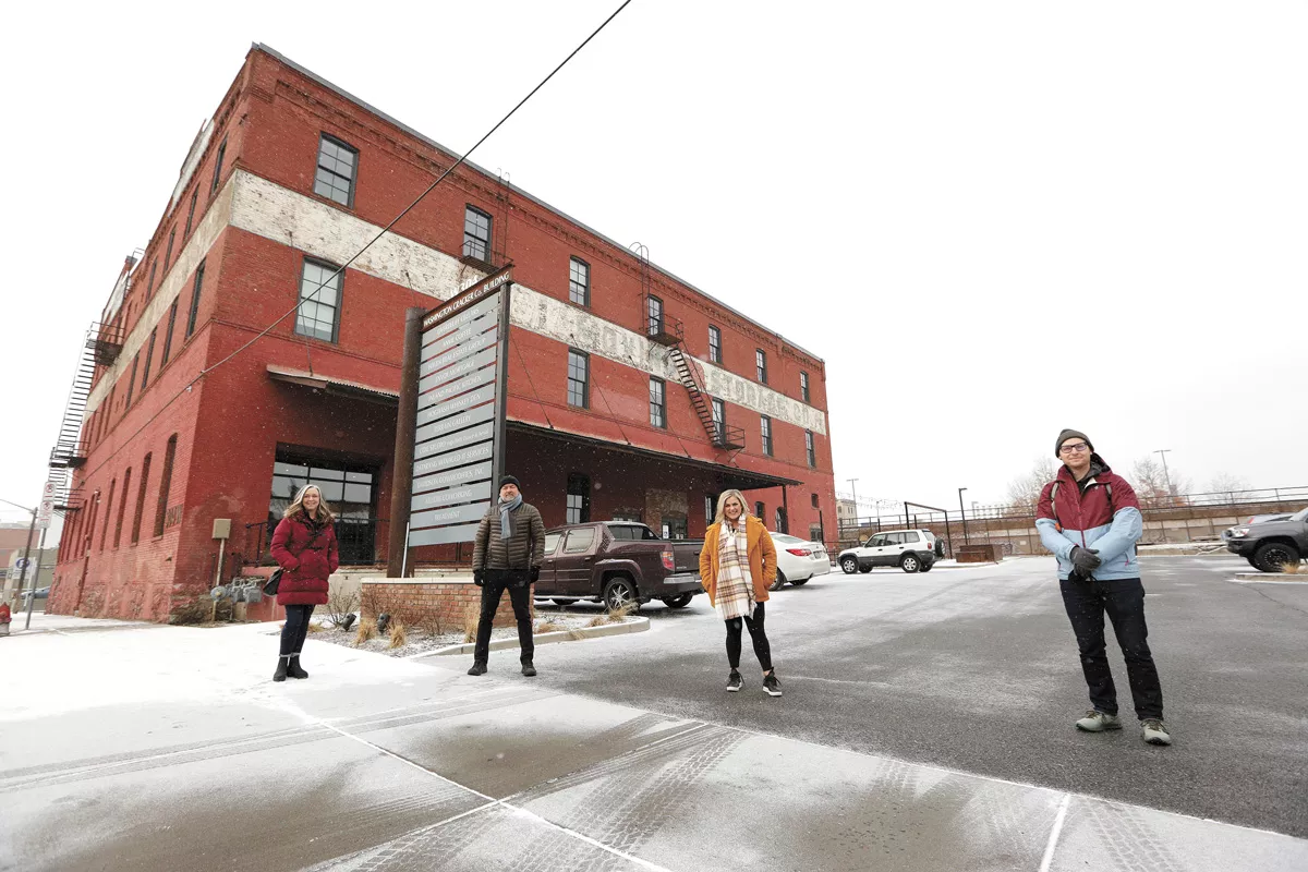 FROM LEFT: Pivot Spokane treasurer Karyn Woodard, president Eric Woodard, board members Morgan Marum and Mark Robbins outside the Washington Cracker Co. Building. - YOUNG KWAK PHOTO