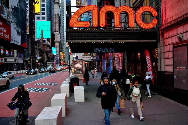 Outside the AMC Empire on 42nd Street in New York, March 6, 2021. Early box office results indicate a messier recovery, with moviegoer tastes potentially shifting — particularly in China, now the No. 1 cinema market in the world — and behind-the-scenes spats between studios and theaters crimping film availability. - GABBY JONES/THE NEW YORK TIMES