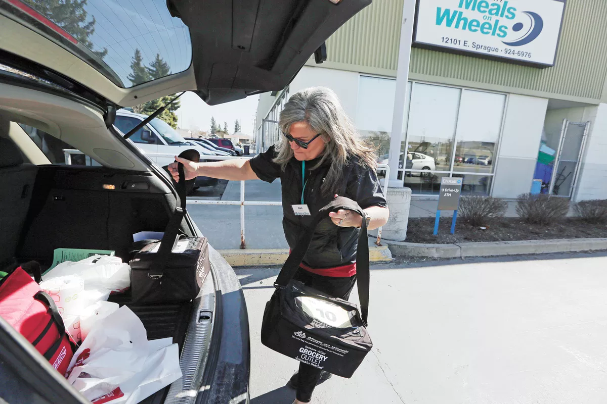 Keri Barham volunteers with Meals on Wheels to deliver meals to seniors last March. - YOUNG KWAK PHOTO