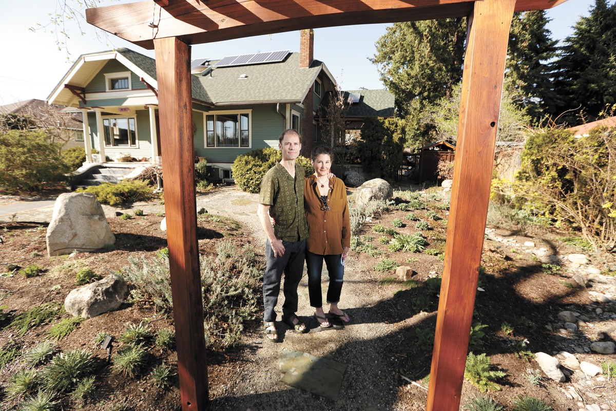 Ethan and Kirsten Angell replaced their lawn with water-efficient plants as part of the SpokaneScape program. - YOUNG KWAK PHOTO