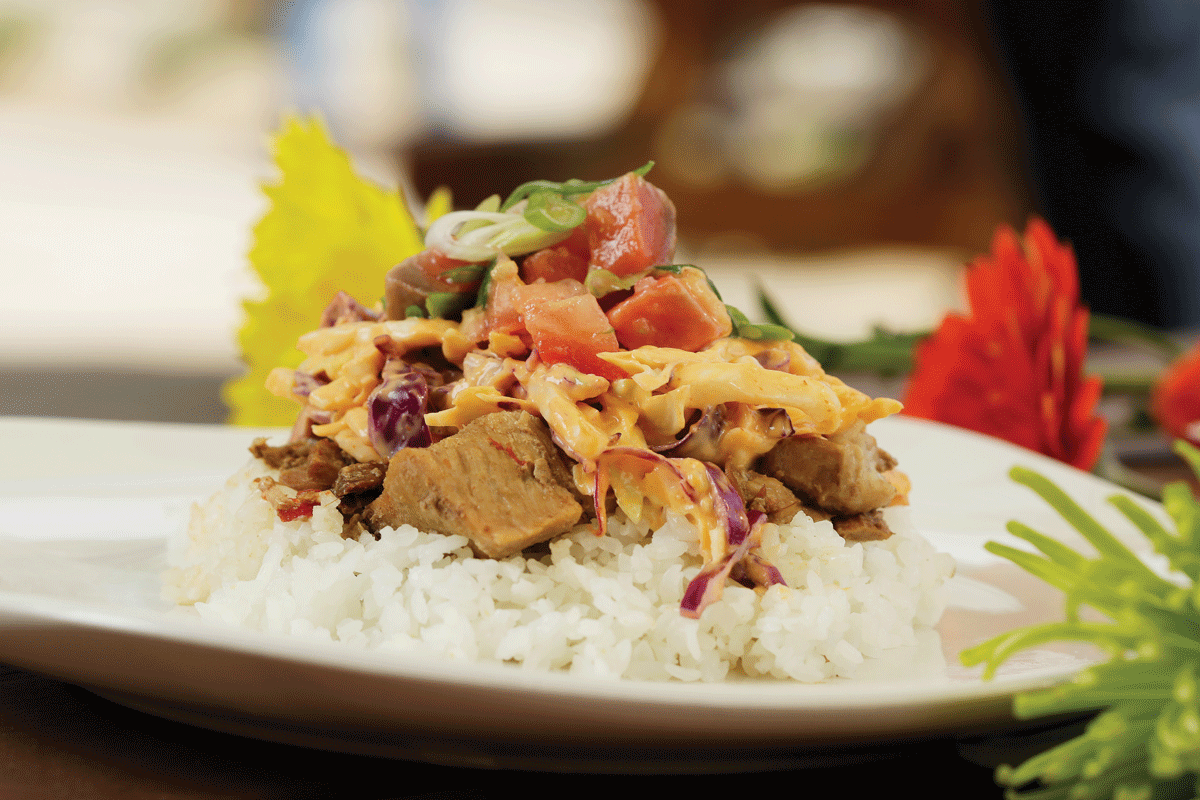 Main Market chef Josh Diogo's kalua pork is adapted from a recipe he used to feed thousands of Gonzaga University students at his previous job. Here, he tops it with Lomi Lomi salmon and coleslaw. - YOUNG KWAK PHOTO