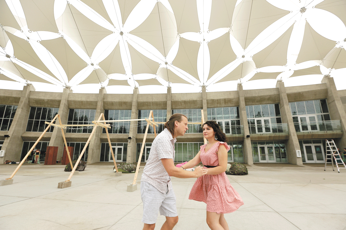 Chad Herrmann (Lysander) and Sarah Plumb (Hermia) rehearse the Spokane Shakespeare Society's production of A Midsummer Night's Dream. - YOUNG KWAK PHOTO