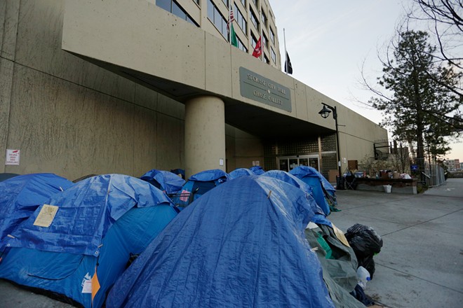 A tent city in front of Spokane City Hall after a protest against the sit-lie ordinance in December 2018. - YOUNG KWAK PHOTO