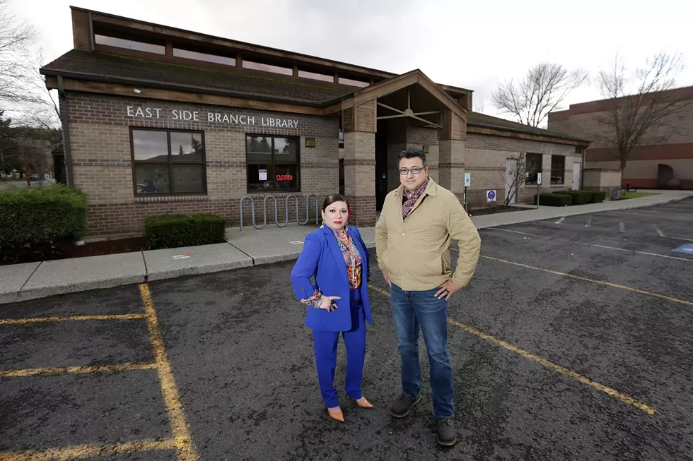 Lili Navarrete (left) and Miguel Gonzales hope to see a Hispanic Community Center in the old East Side Library. - YOUNG KWAK PHOTO