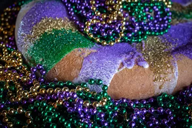 Vieux Carre is serving slices of its house-made King Cake, a Mardi Gras tradition, for the dessert course. - ALYSSA HUGHES