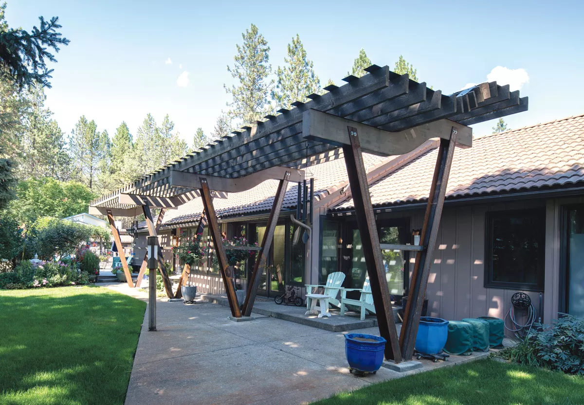 A unique curved pergola along the side of the house was supplemented a few years later with a complementary outdoor living area shaded with a new pergola. Both pergolas were designed by Hanson Carlen Architecture and Construction. - HANSON CARLEN PHOTO