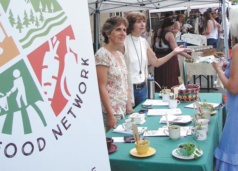 The Inland Northwest Food Network visits farmers markets to help connect residents to their food sources. - CARRIE SCOZZARO