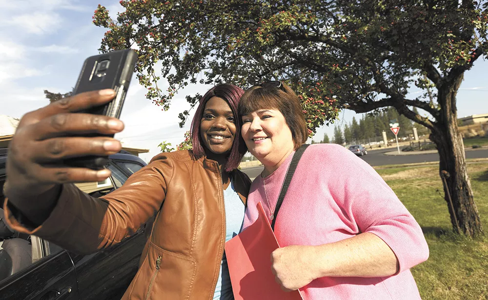 Spokane City Councilwoman Karen Stratton (right) takes a break from campaigning to snap a selfie with local activist Kitara Johnson. - YOUNG KWAK