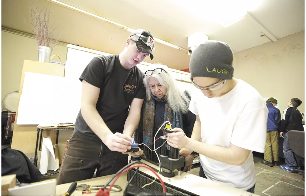 Students prep for the FIRST Robotics Competition later this spring with the help of Gizmo CDA co-founder Barbara Mueller. - YOUNG KWAK