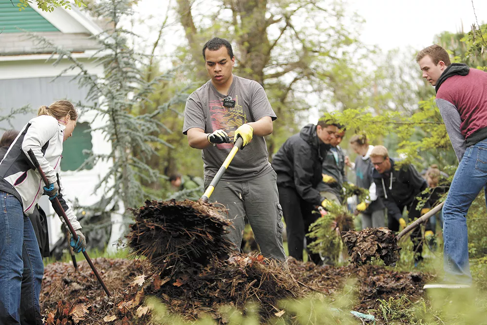 Along with landscaping, volunteers cleaned trash, repaired houses and painted murals along East Sprague. - YOUNG KWAK