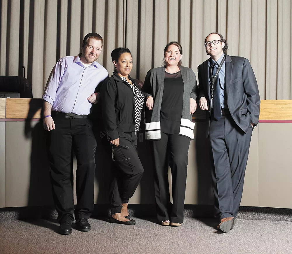 FROM LEFT: Blaine Stum, assistant to Councilman Breean Beggs; Anna Everano, assistant to Councilman Mike Fagan; Kaitlin Larson, assistant to Councilwoman Amber Waldref; and Adam McDaniel, assistant to Council President Ben Stuckart. - YOUNG KWAK