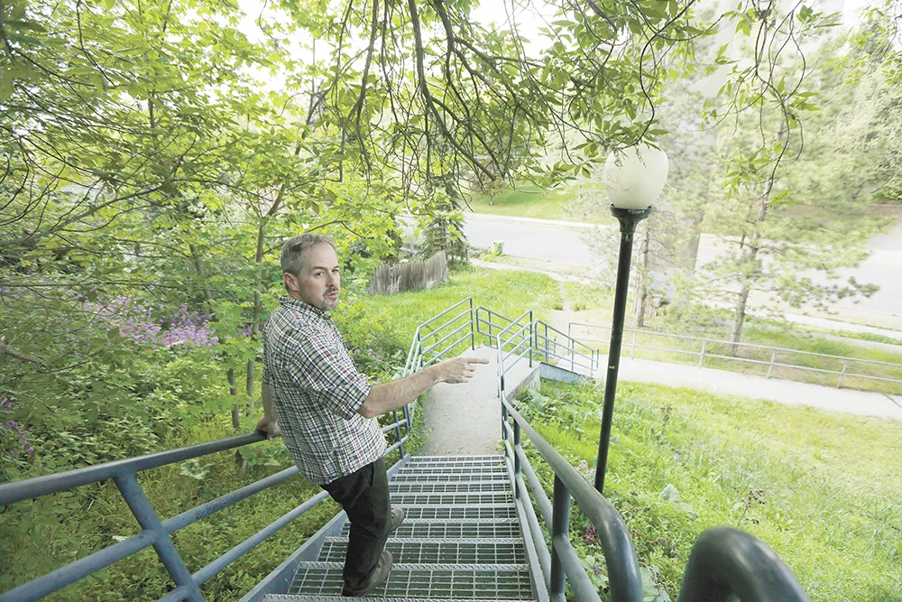 Tod Marshall strolls his Peaceful Valley neighborhood during a rare respite in his schedule as Washington's poet laureate. - YOUNG KWAK