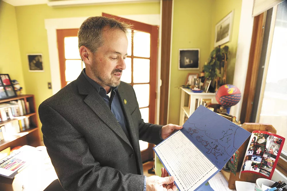Part of Tod Marshall's job as poet laureate is outreach. Here, he reads a thank-you note from an elementary student. - YOUNG KWAK