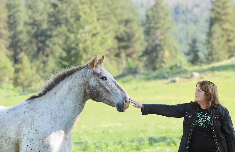 Mary Ciais on the family ranch in May. Of all their horses, Splash was one Rafe particularly liked, both sharing distinctive white hair. - MIKE SALSBURY