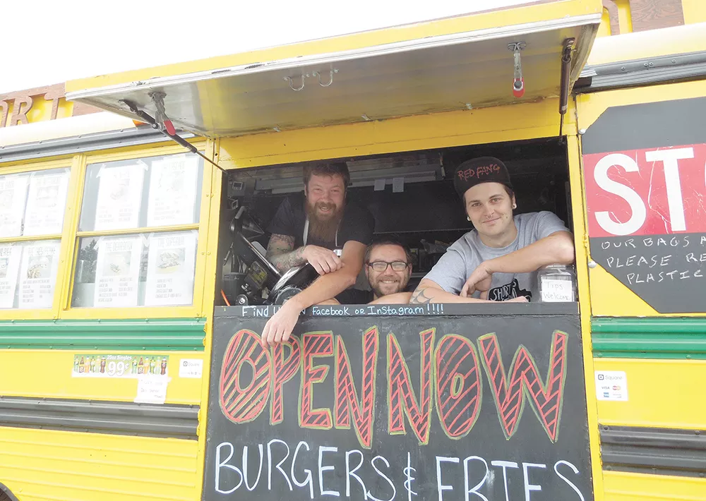 Short Bus Bistro co-owners, from left to right, Justin Dennis, Richard Reidt and Chris Crow spent years retrofitting the bus’s kitchen. - CHEY SCOTT
