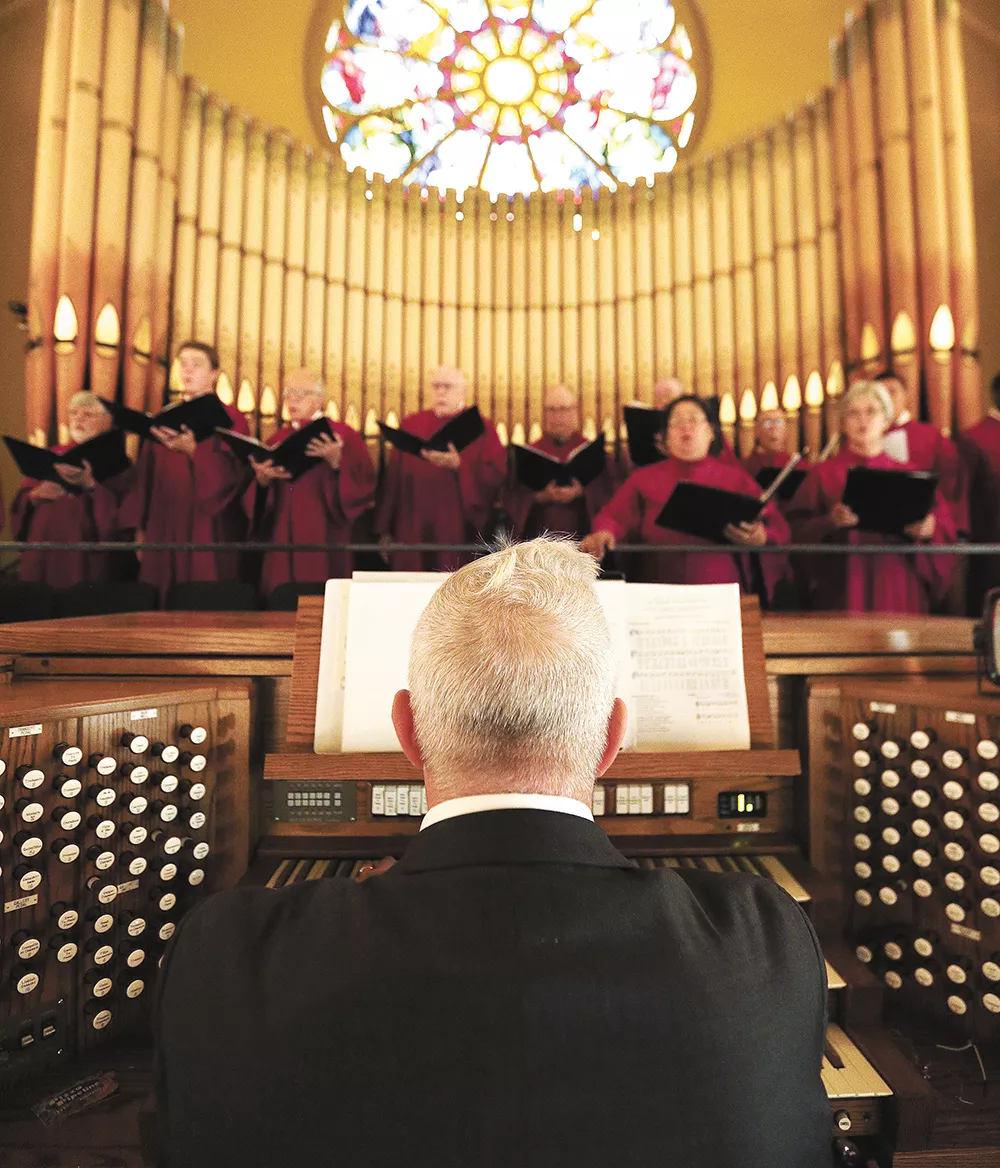 Organist Keith Thomas accompanies the Cathedral of Our Lady of Lourdes choir during mass last weekend. - YOUNG KWAK