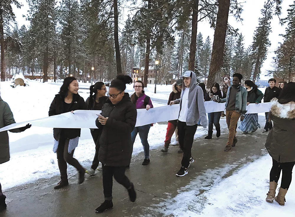 Whitworth students march to the university president's office with a petition to declare the school a "sanctuary campus."