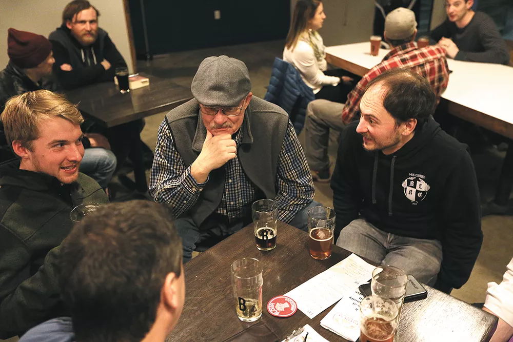 Palouse Heritage farm co-owner Don Scheuerman, center, and Palouse Pint's Joel Williamson, right, chat with attendees at the Purple Egyptian Barley Project's first week. - YOUNG KWAK