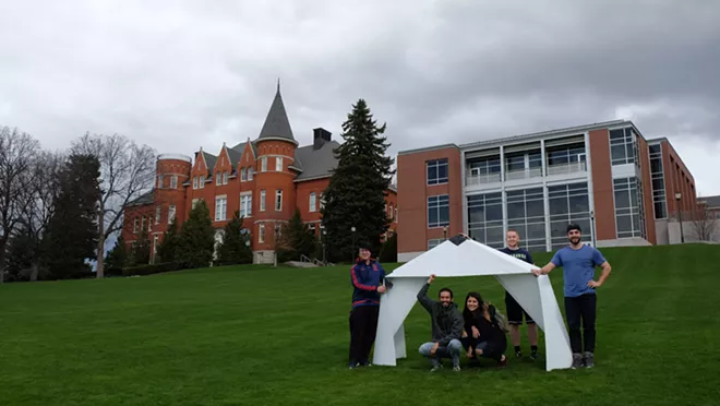 Washington State University students pose with part of a prototype homeless shelter they're making for a design competition put on by the Spokane chapter of the American Institute of Architects. - COURTESY WSU SCHOOL OF DESIGN + CONSTRUCTION