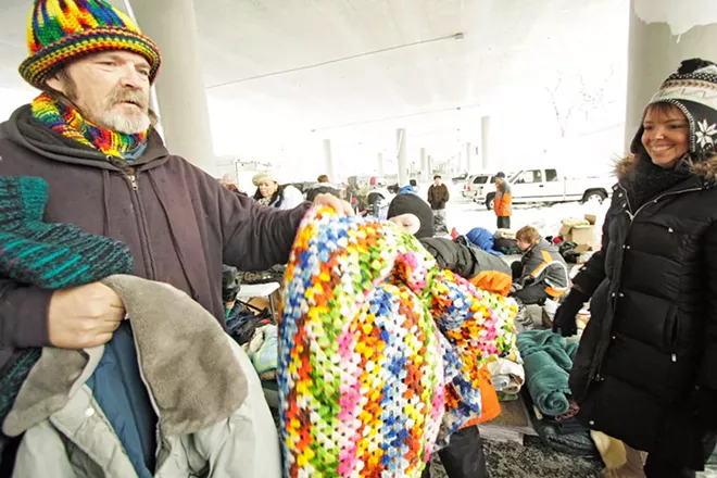 The Blessings Under the Bridge group has been asked by the City of Spokane to move where it helps the local homeless population. - YOUNG KWAK