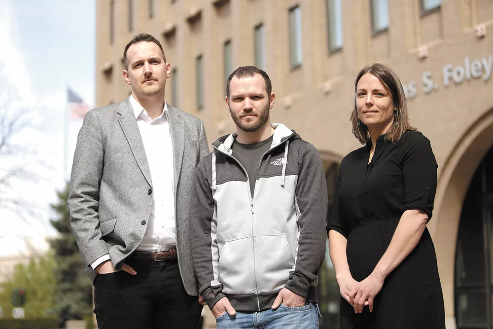 Jerad Kynaston (center) was prepared to plead guilty. Then his lawyers, Jeff Dahlberg (left) and Alison Guernsey discovered previously unreleased police reports. - YOUNG KWAK