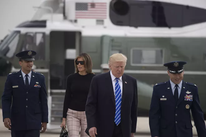 President Donald Trump and first lady Melania Trump prepare to board Air Force One en route to Europe, at Joint Base Andrews in Maryland, July 5, 2017. Trump has plans to meet Russian President Vladimir Putin face-to-face this week on the sidelines of the Group of 20 economic summit gathering in Hamburg, Germany. - STEPHEN CROWLEY/THE NEW YORK TIMES