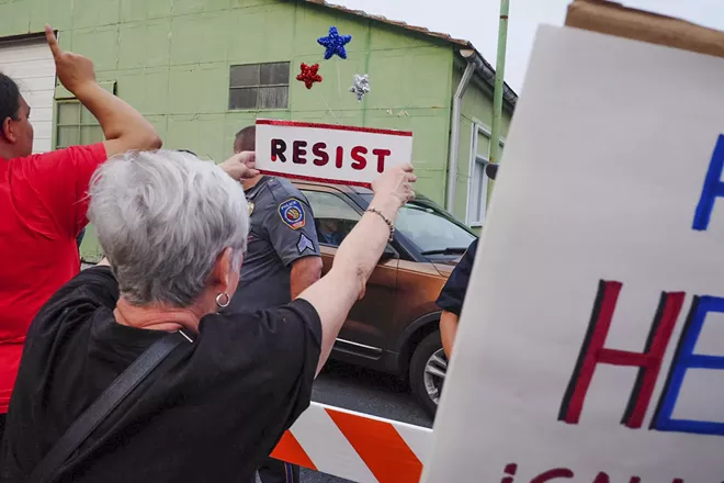 A car carrying Sen. Pat Toomey, who helped draft the Republican health care bill, passes demonstrators in Harrisburg, Pa., July 5, 2017. With Republican health care legislation hanging in the balance, activists feeling betrayed by leaders they helped elect have turned their focus to other issues. - NOAH SCIALOM/THE NEW YORK TIMES