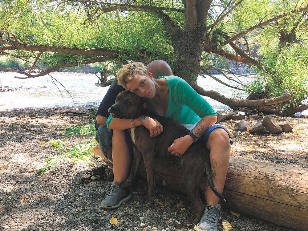 Destiny Brown and her dog Mister had camped along the river, until police told them they had to go. - MITCH RYALS