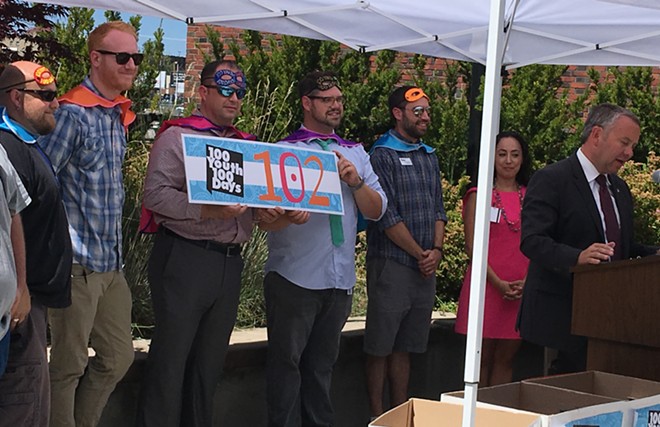Spokane Mayor David Condon, right, congratulates city staff, outside agencies, and businesses that worked to house more than 100 youth in 100 days.