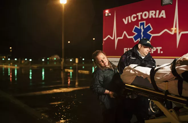 Jami Leifeste, an emergency medical technician, is helped by a co-worker as they evacuate a patient from Citizens Medical Center to another hospital, in Victoria, Texas, Aug. 26, 2017. Houston’s world-renowned health care infrastructure found itself battered by Hurricane Harvey, testing whether officials had done enough to prepare. - ALYSSA SCHUKAR/THE NEW YORK TIMES