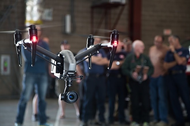 Members of the Spokane Fire Department's drone team watch a demonstration. - COURTESY OF SFD