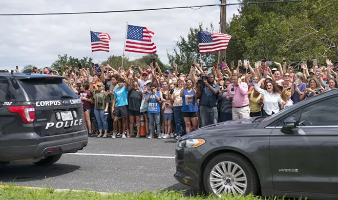 Supporters outside a fire station where President Donald Trump participated in a briefing on relief efforts following Hurricane Harvey, in Corpus Christi, Texas, Aug. 29, 2017. After conferring with local, state and federal emergency management officials here, Trump plans to travel to Austin, the state capital. - DOUG MILLS/THE NEW YORK TIMES