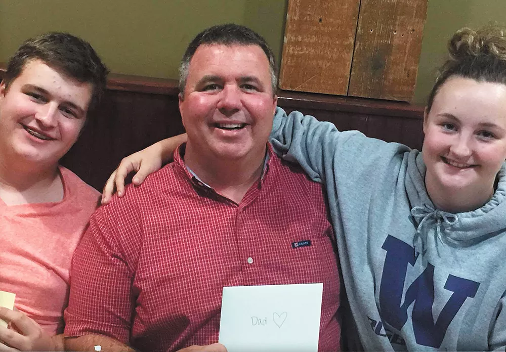 Sam Strahan (left) was killed after he confronted a classmate who brought guns to school. Sam's father, Scott (center), died just 12 weeks before.