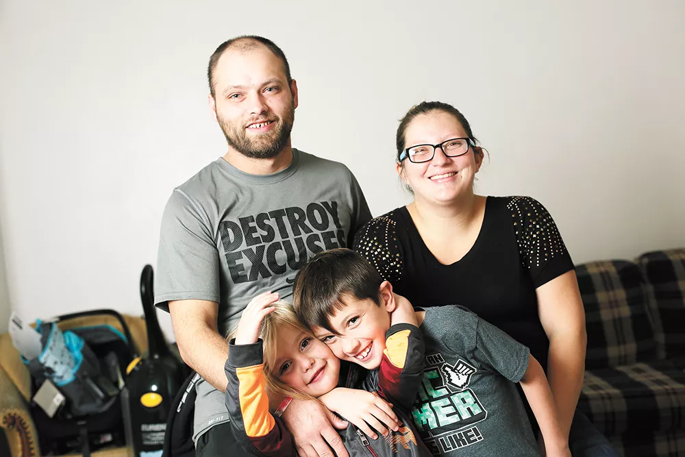 Thanks to a project by Priority Spokane, Brandon Taylor and Ashley Stannard found a home for their three kids the day before school started this fall. - YOUNG KWAK