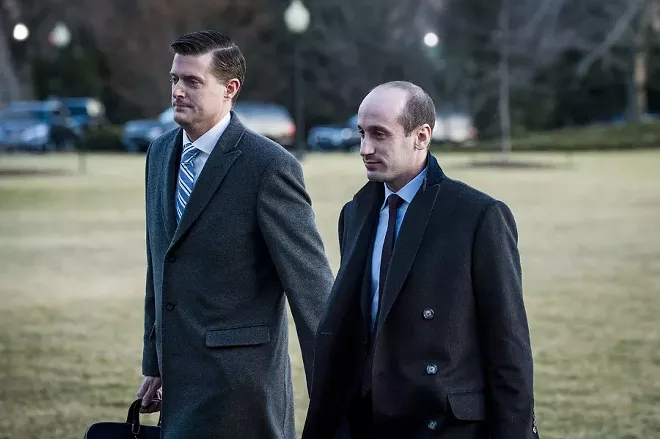 White House Staff Secretary Rob Porter, left, and Stephen Miller, the senior policy adviser, cross the South Lawn at the White House in Washington, Feb. 5, 2018. Porter said Wednesday that he would resign his position, a day after a news account that quoted his two ex-wives accusing him of physical abuse during the course of their marriages. - PETE MAROVICH/ THE NEW YORK TIMES