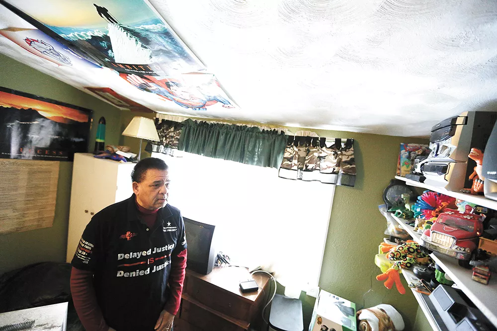 Ron Simon walks through Bruce's bedroom, with childhood toys still on the shelves, in hopes he returns someday. - YOUNG KWAK