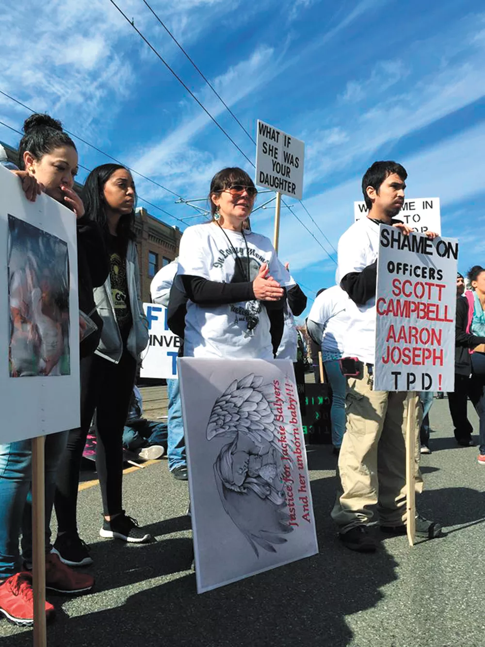 Jacqueline Salyers' mother, Lisa Earl (third from left), turned to activism after her daughter's death by police.