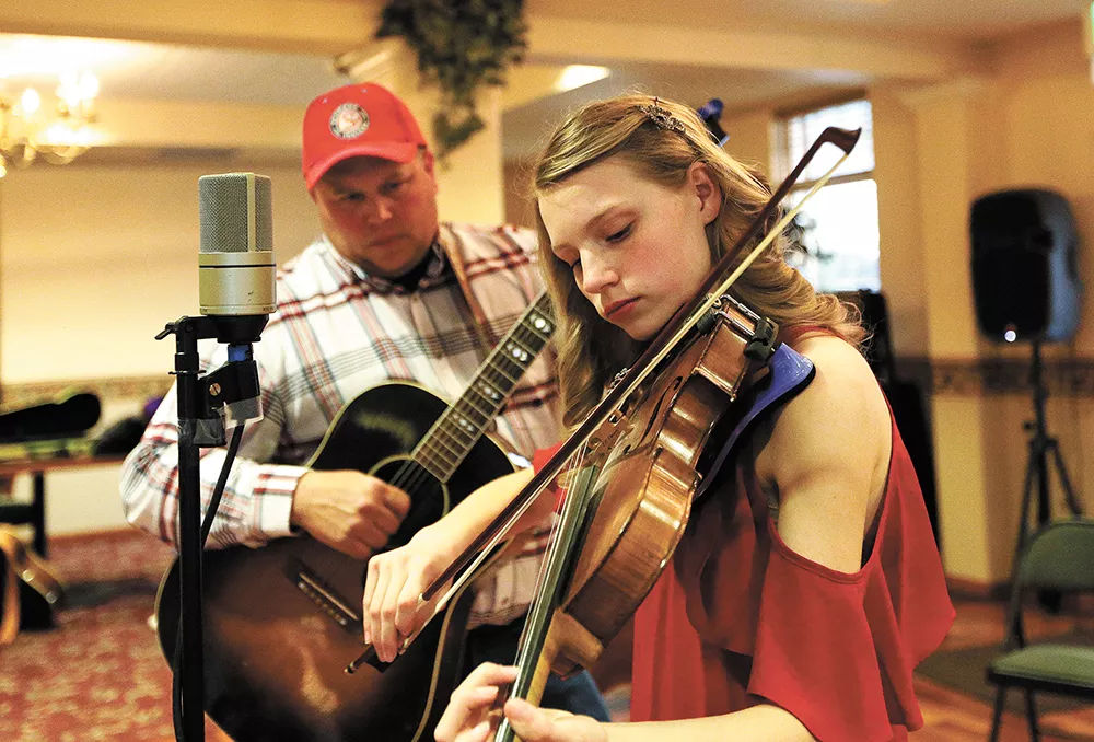 Emilie Miller, 15, accompanied here by her father, Ed, plays in contests around the country. - YOUNG KWAK