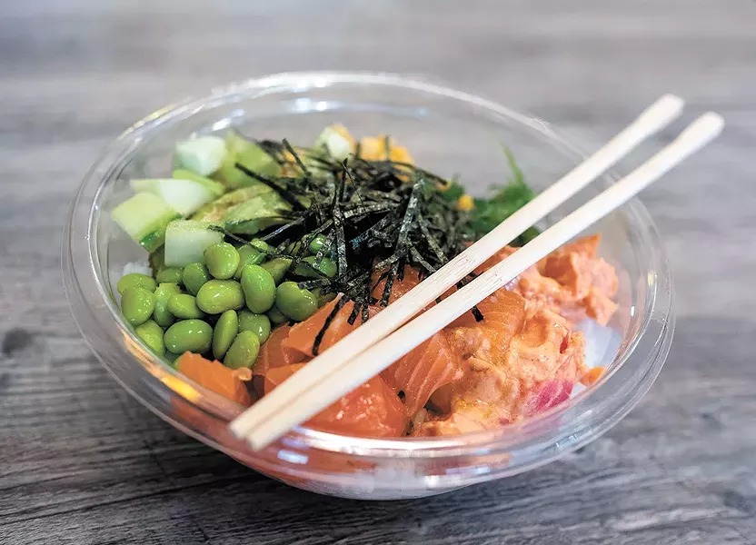 The salmon poke bowl with a side of spicy tuna. - HECTOR AIZON PHOTO