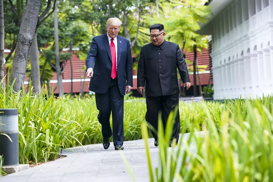 President Donald Trump gestures to Kim Jong Un of North Korea as they take a walk after their lunch on Sentosa Island in Singapore, June 12, 2018. Trump’s eager embrace of Kim this week, on the heels of an acrid falling-out with Prime Minister Justin Trudeau of Canada, raised an obvious, if confounding, question: Why would an American president offend allies and cozy up to adversaries? - DOUG MILLS/THE NEW YORK TIMES