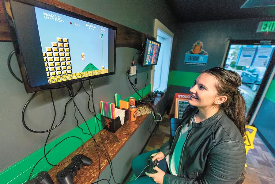 Brooke Wayman takes on Super Mario Bros. at GeeksNGlory. - ERICK DOXEY PHOTO